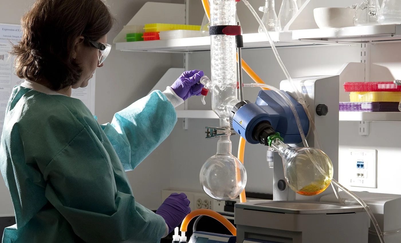 Scientist operating a modern rotary evaporator